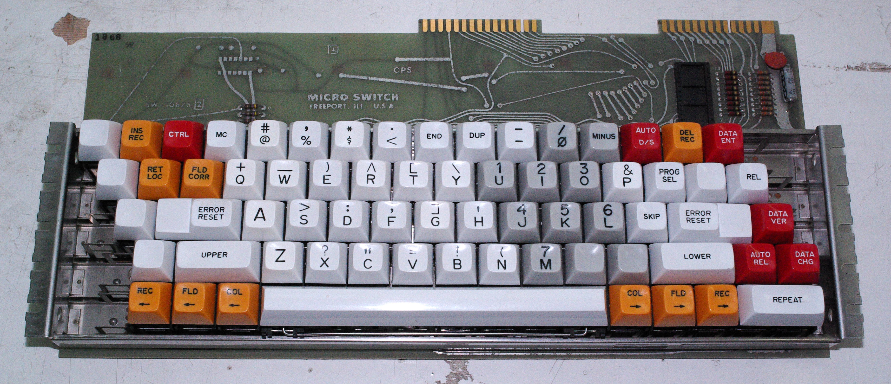 Shot with flash. . That chip at the top right has a Texas Instuments logo on it. Other than that there is little on the PCB.